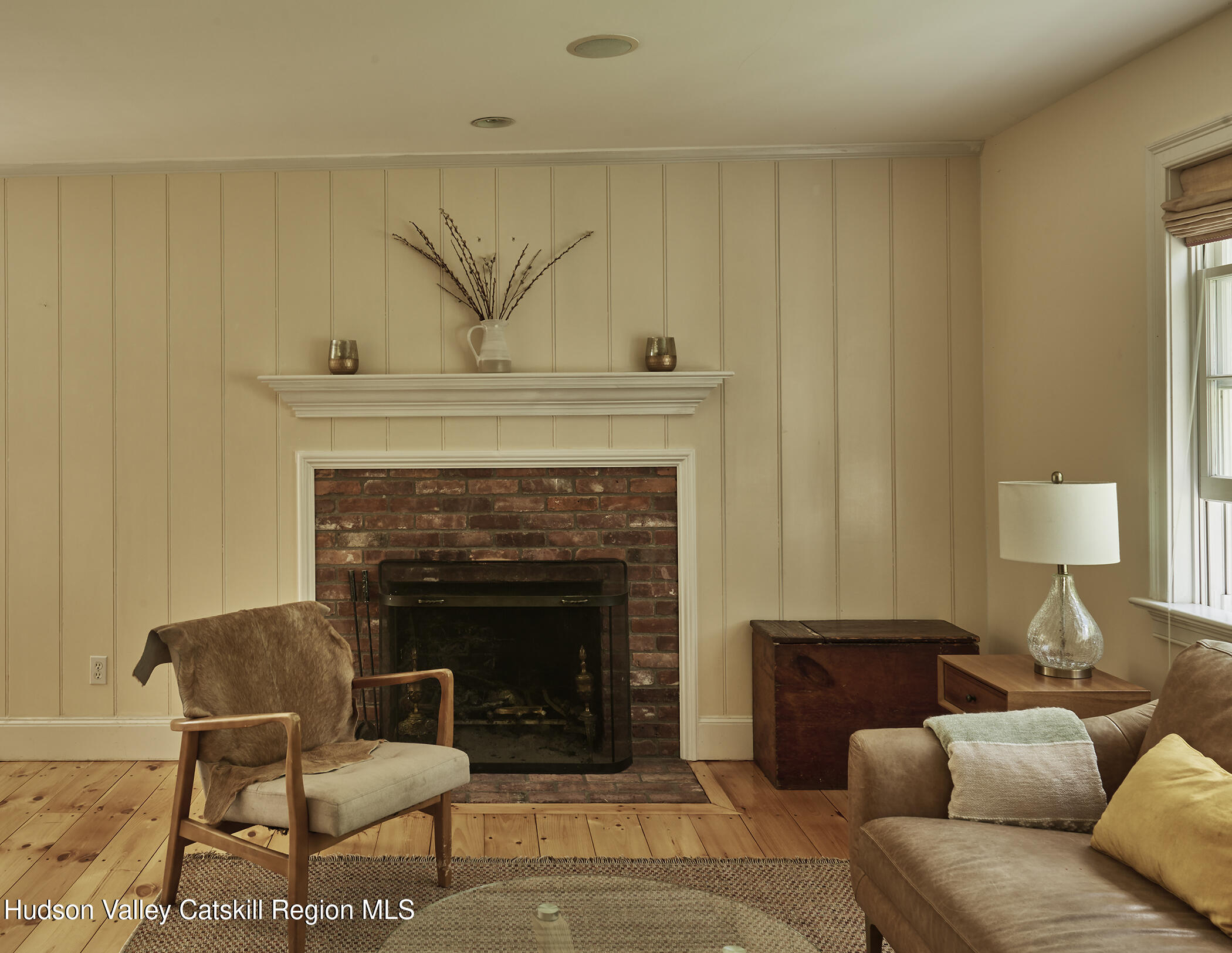 864 West End Road Hillsdale, NY 12529 - Photo 12 of 42 a living room with furniture and a fireplace