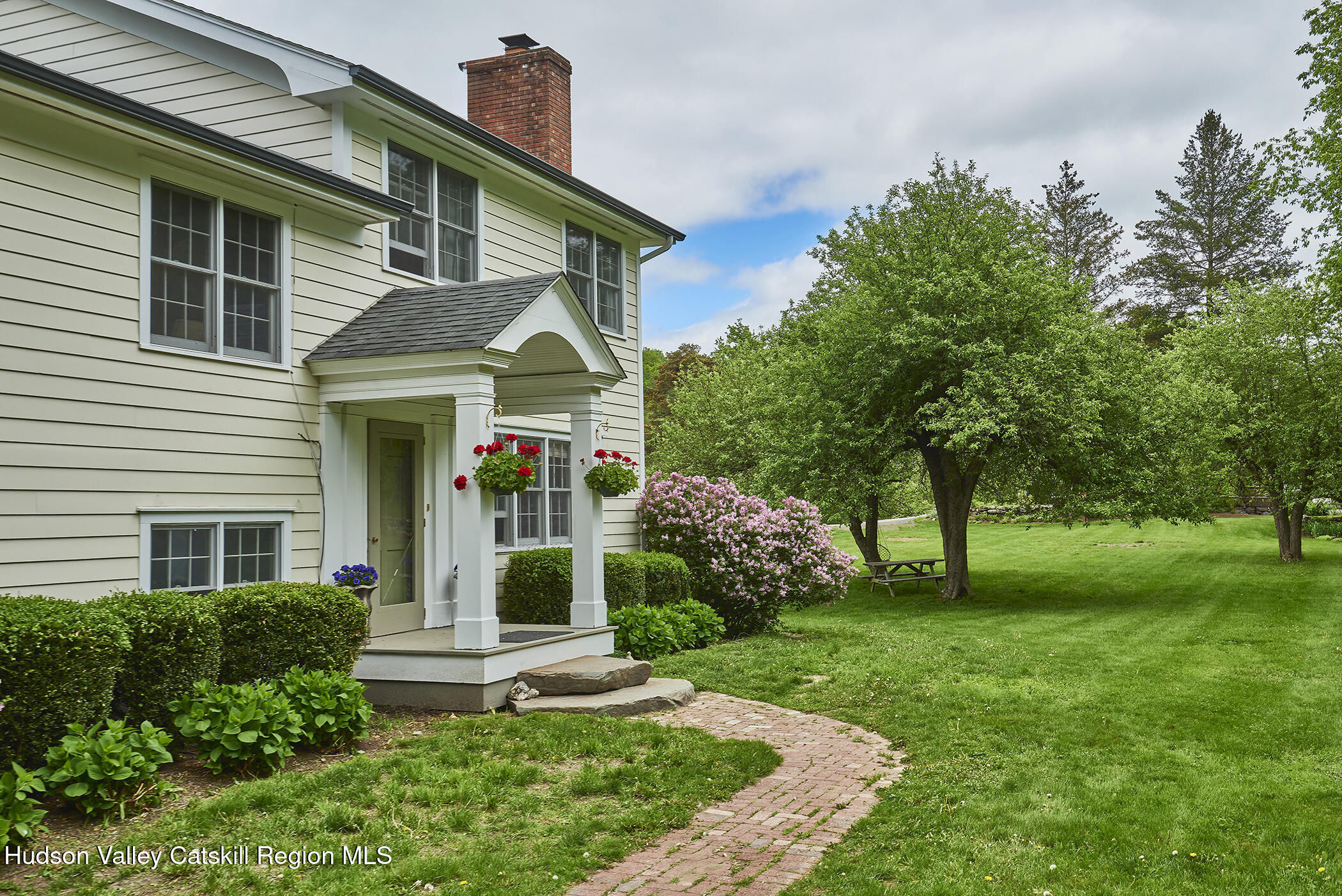 864 West End Road Hillsdale, NY 12529 - Photo 2 of 42 a front view of a house with a yard