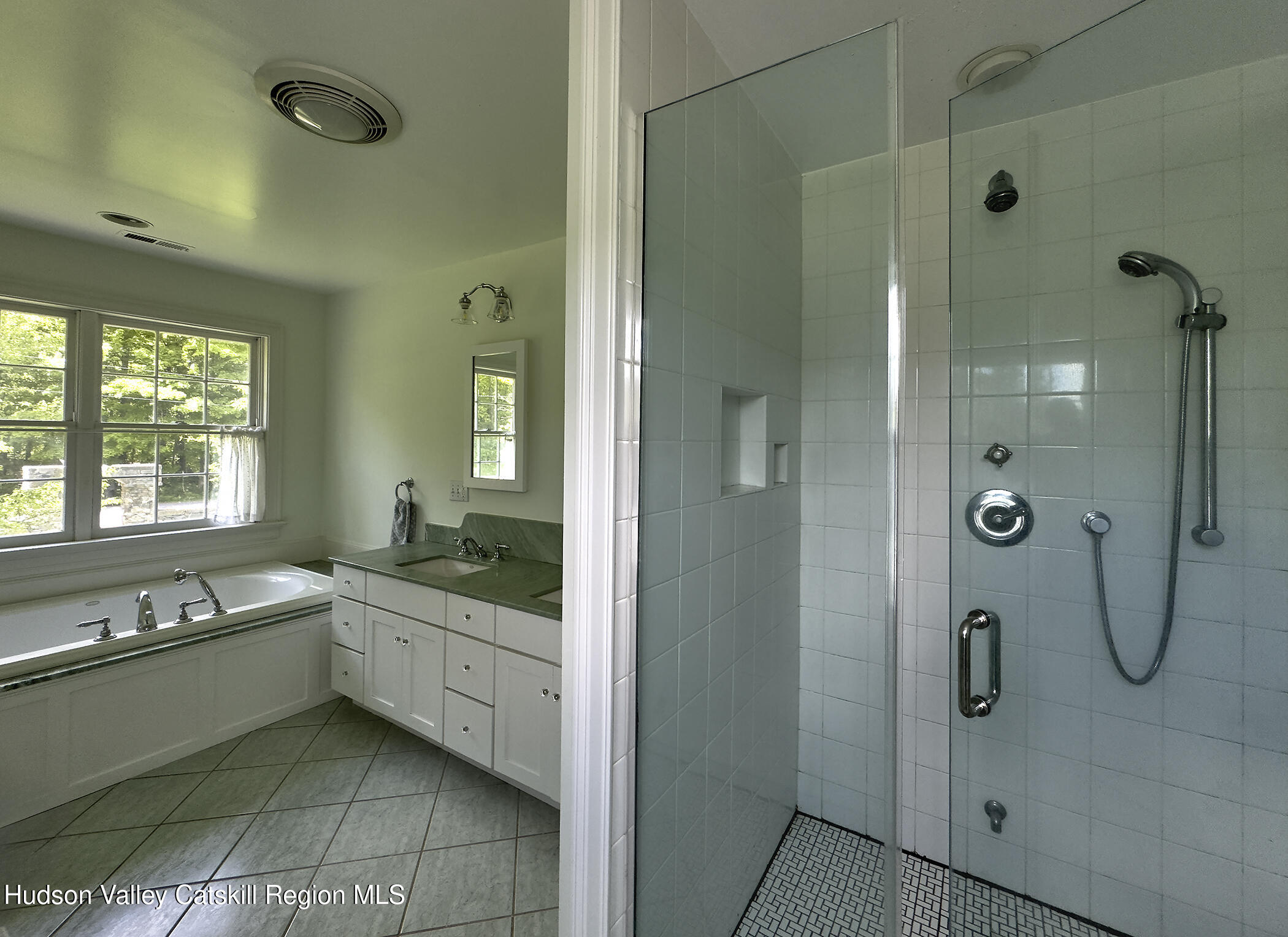 864 West End Road Hillsdale, NY 12529 - Photo 22 of 42 a bathroom with a granite countertop sink a mirror and a bathtub