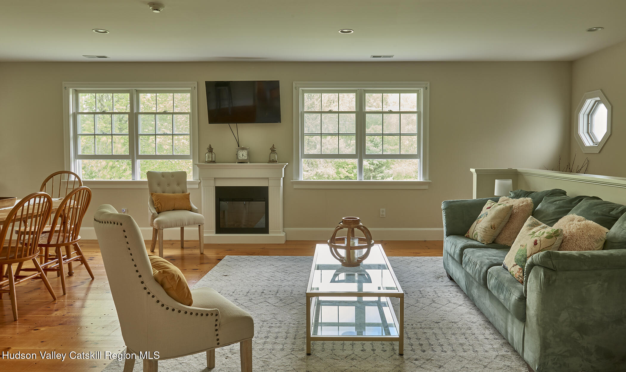 864 West End Road Hillsdale, NY 12529 - Photo 31 of 42 a living room with furniture a flat screen tv and a fireplace