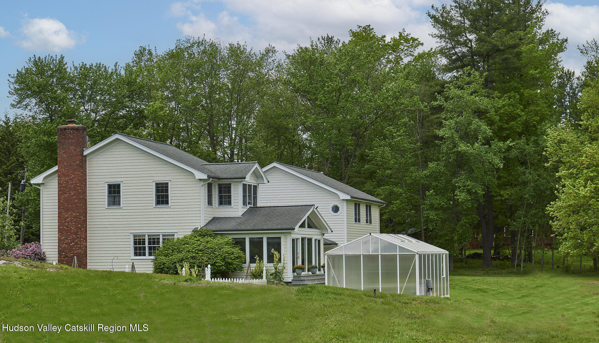 864 West End Road Hillsdale, NY 12529 - Photo 6 of 42 a front view of a house with a garden