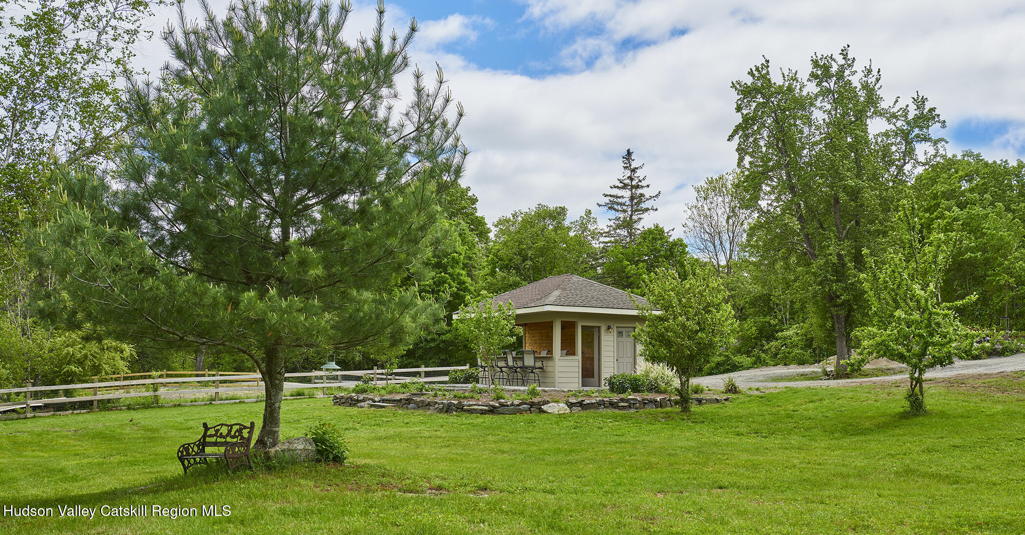 864 West End Road Hillsdale, NY 12529 - Photo 10 of 42 a view of a patio with a table and chairs under an umbrella
