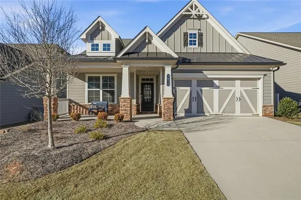 a front view of a house with garden