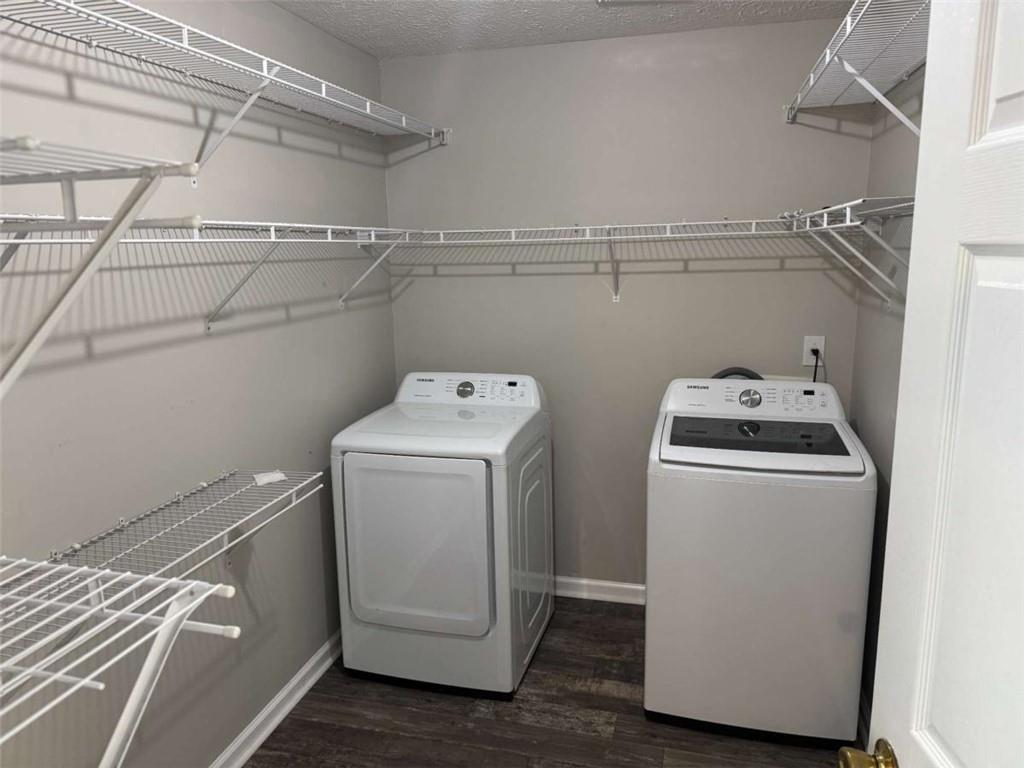 1672 Walters Park Court Loganville, GA 30052 - Photo 15 of 35 a utility room with dryer and washer