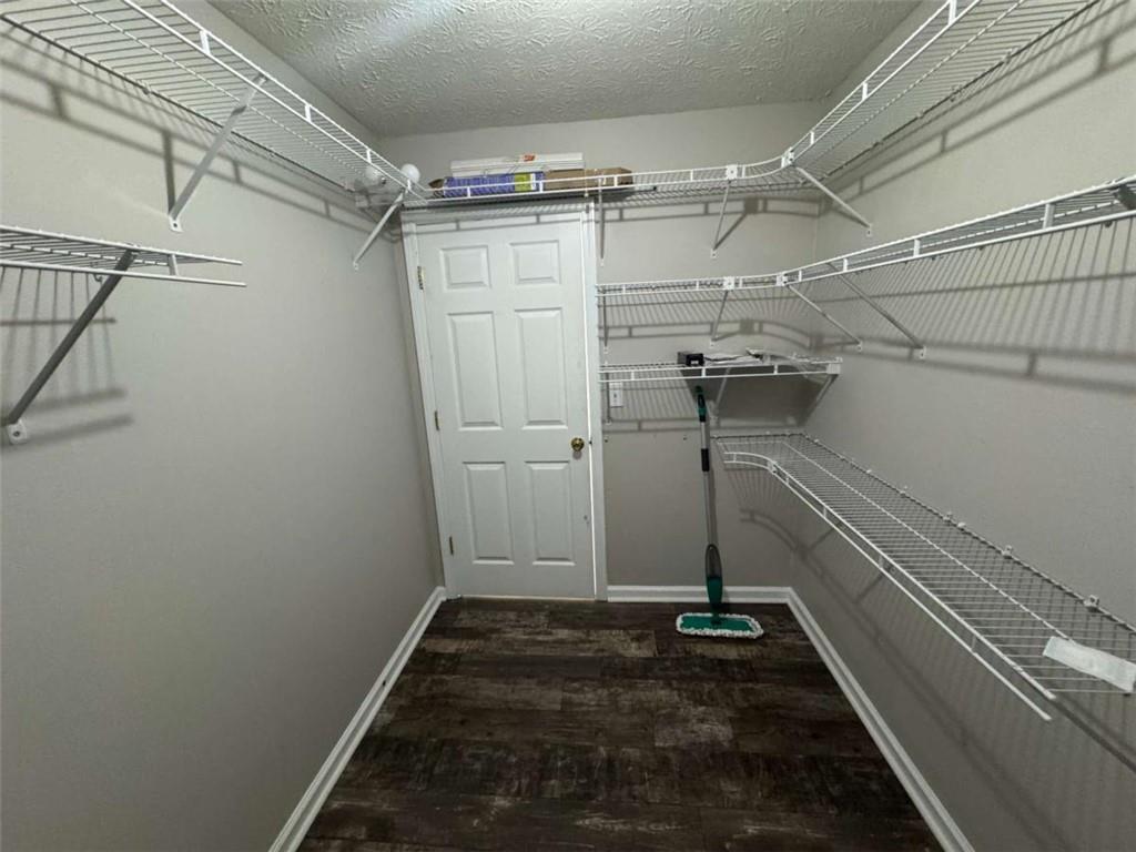 1672 Walters Park Court Loganville, GA 30052 - Photo 16 of 35 a view of a room with racks on the wall