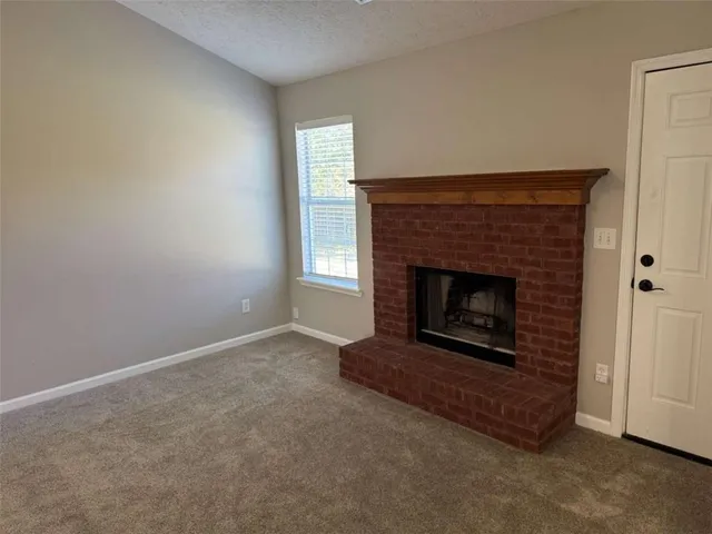 a living room with a fireplace