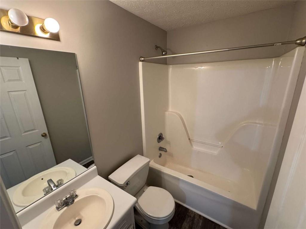 1672 Walters Park Court Loganville, GA 30052 - Photo 26 of 35 a white toilet sitting next to a bathroom sink