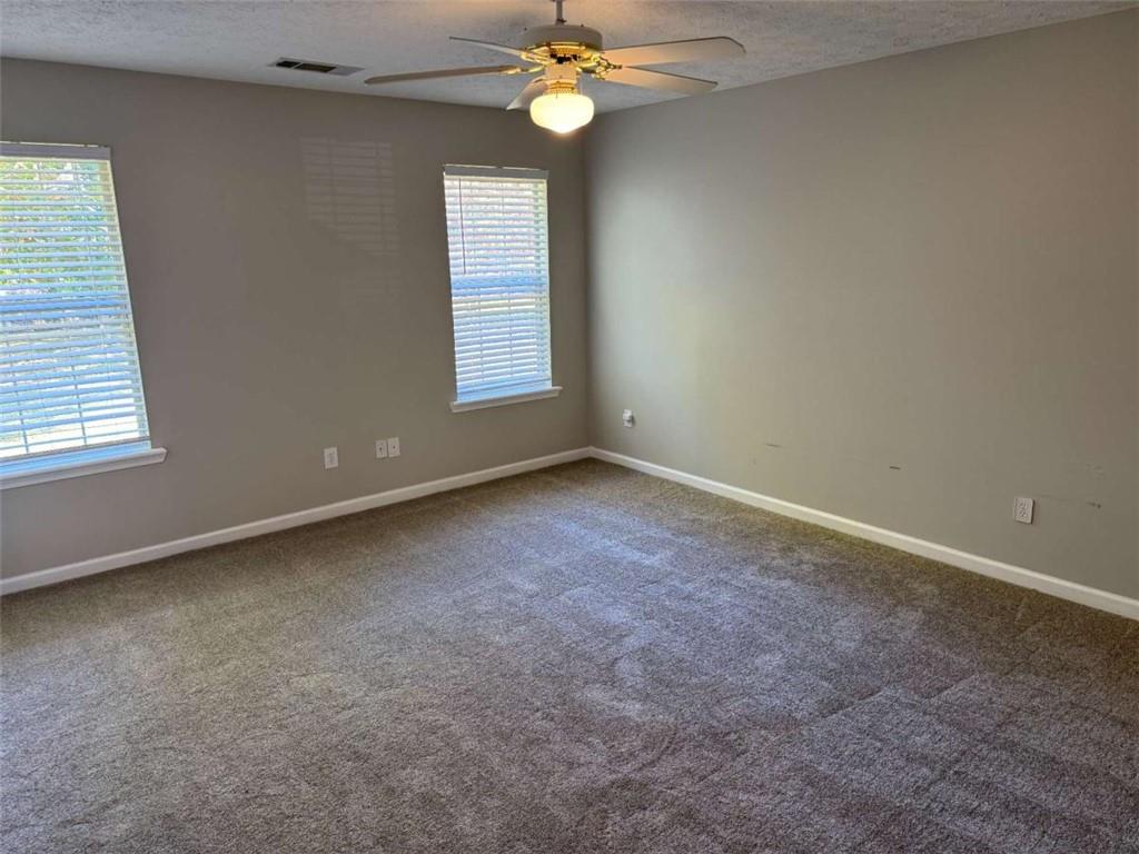 1672 Walters Park Court Loganville, GA 30052 - Photo 27 of 35 an empty room with a window