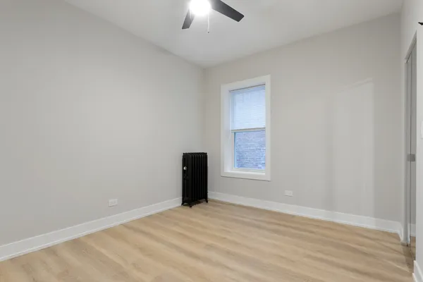 an empty room with a empty space and a window