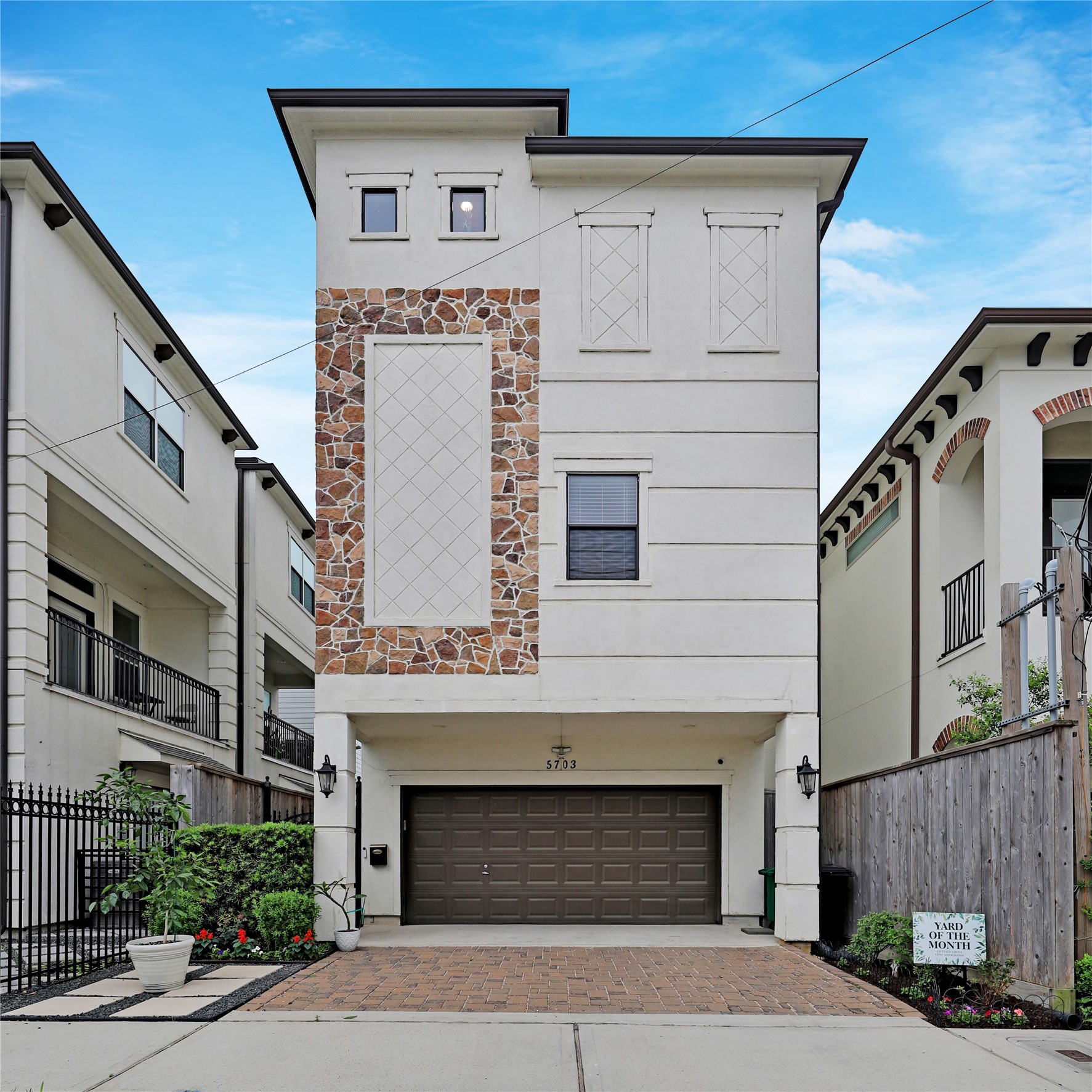 5703 Kansas Street Houston, TX 77007 - Photo 1 of 20 a front view of a building with garage