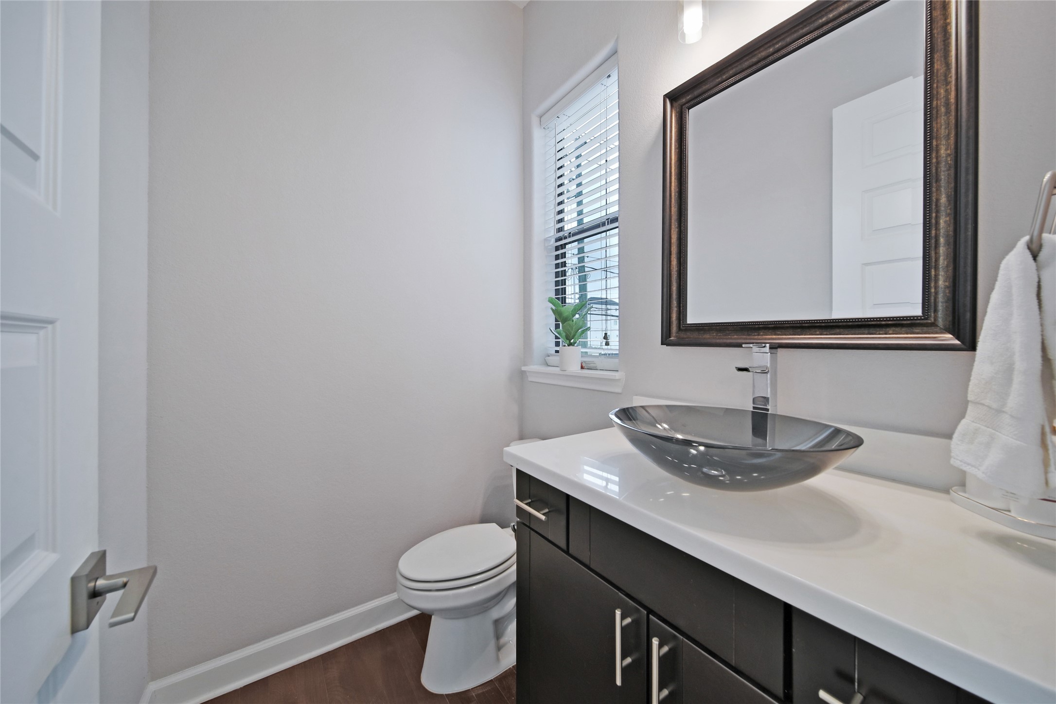 5703 Kansas Street Houston, TX 77007 - Photo 14 of 20 a bathroom with a toilet sink and mirror