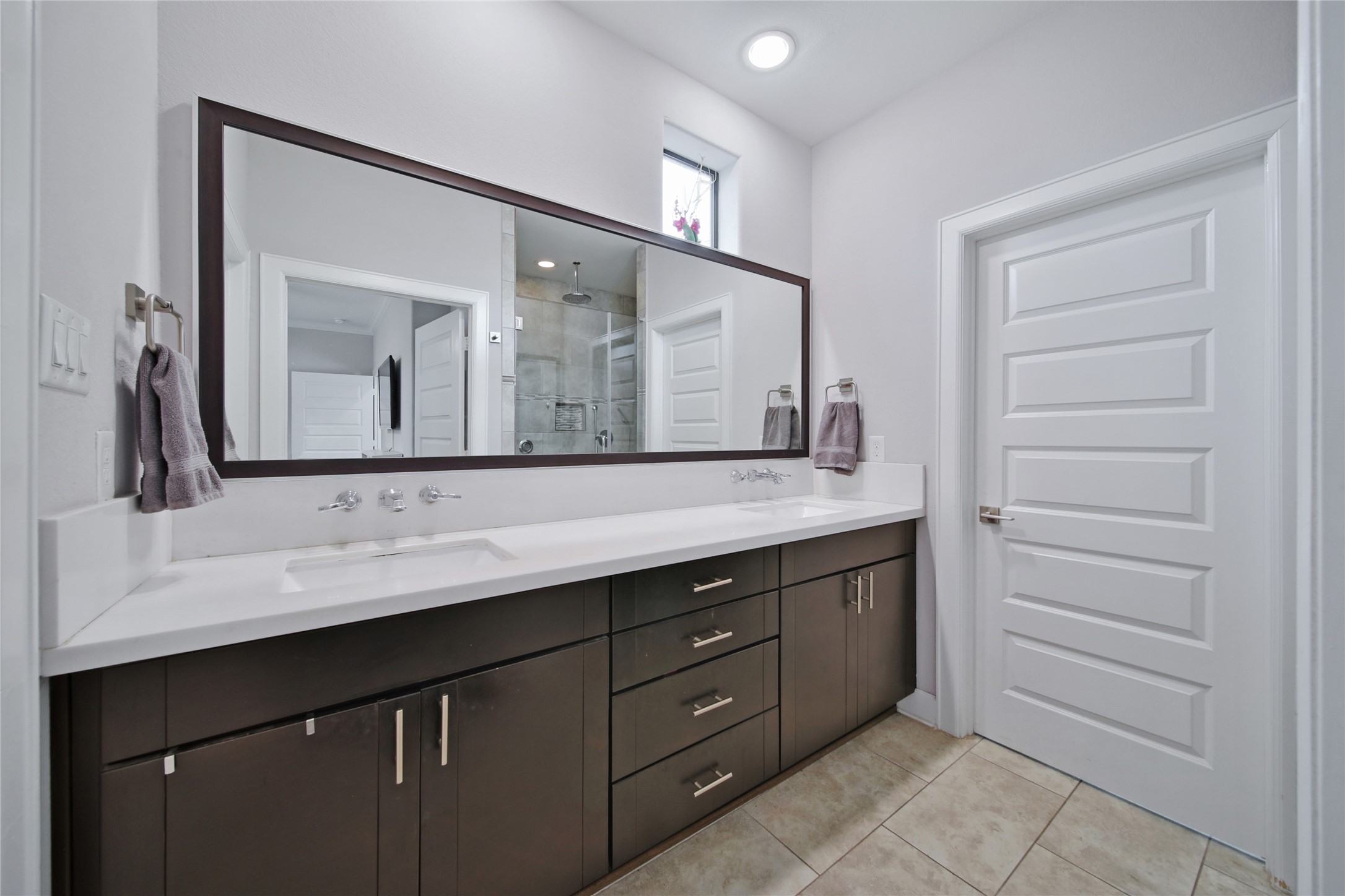5703 Kansas Street Houston, TX 77007 - Photo 17 of 20 a bathroom with a granite countertop sink vanity and mirror