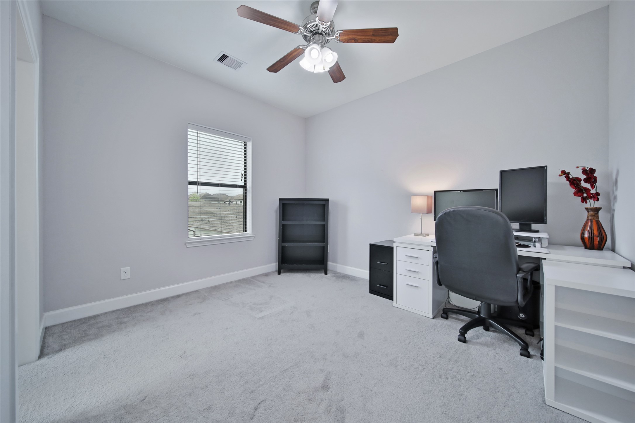 5703 Kansas Street Houston, TX 77007 - Photo 18 of 20 a view of a workspace with furniture and a window