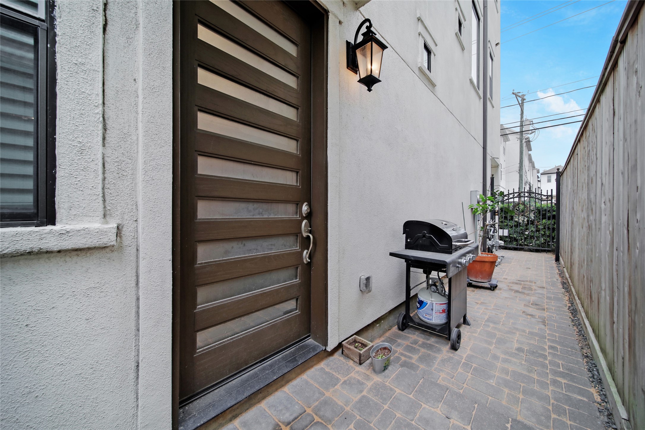 5703 Kansas Street Houston, TX 77007 - Photo 2 of 20 a bench is sitting in front of a door