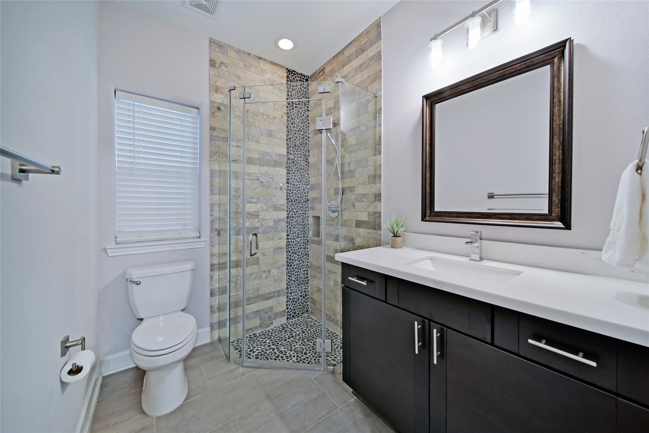 5703 Kansas Street Houston, TX 77007 - Photo 5 of 20 a bathroom with a toilet sink and shower