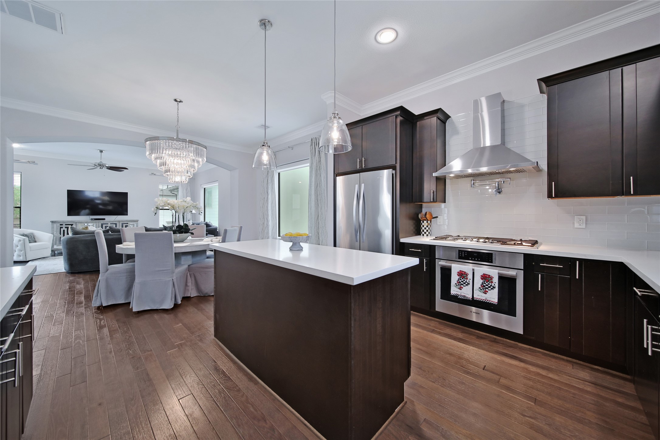 5703 Kansas Street Houston, TX 77007 - Photo 6 of 20 a kitchen with stainless steel appliances granite countertop a sink a stove and a refrigerator