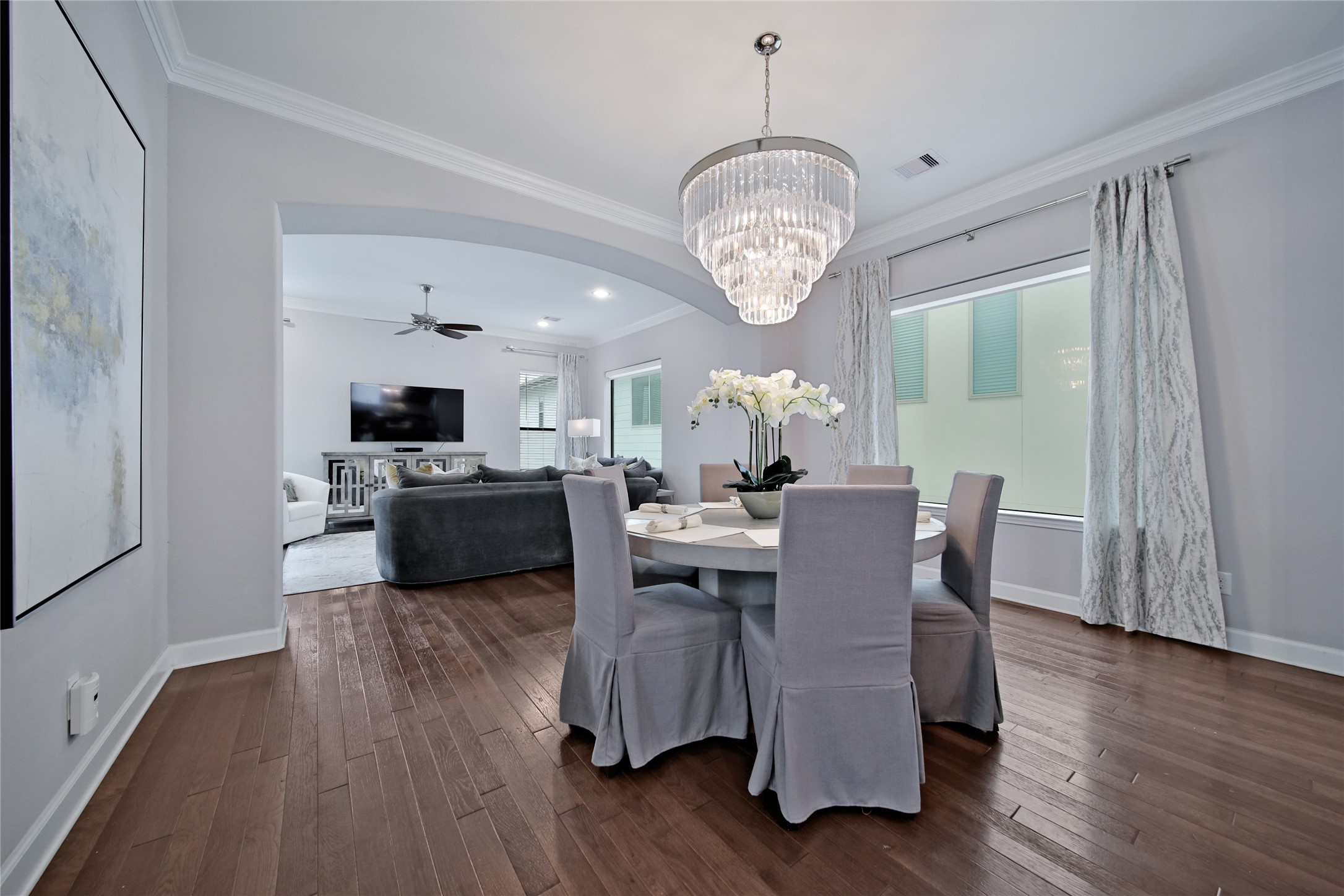 5703 Kansas Street Houston, TX 77007 - Photo 10 of 20 a view of a dining room with furniture wooden floor and chandelier