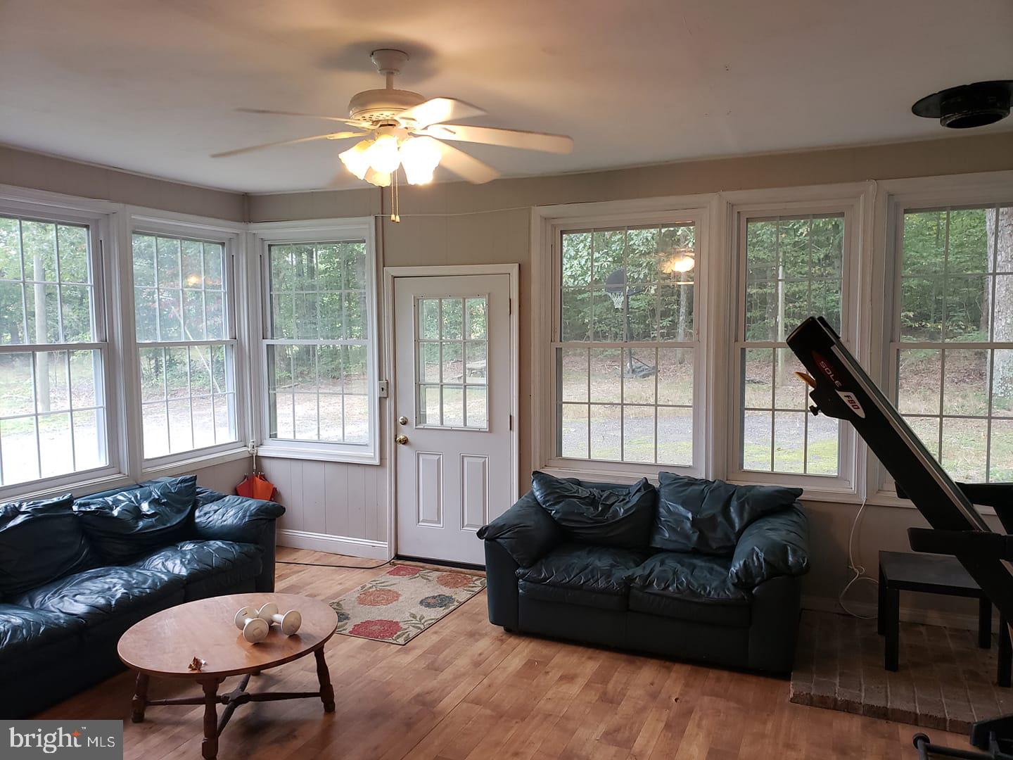 6004 Burr Hill Road Rhoadesville, VA 22542 - Photo 11 of 21 Sunroom w/Laminate Floors/Vented for Wood Stove