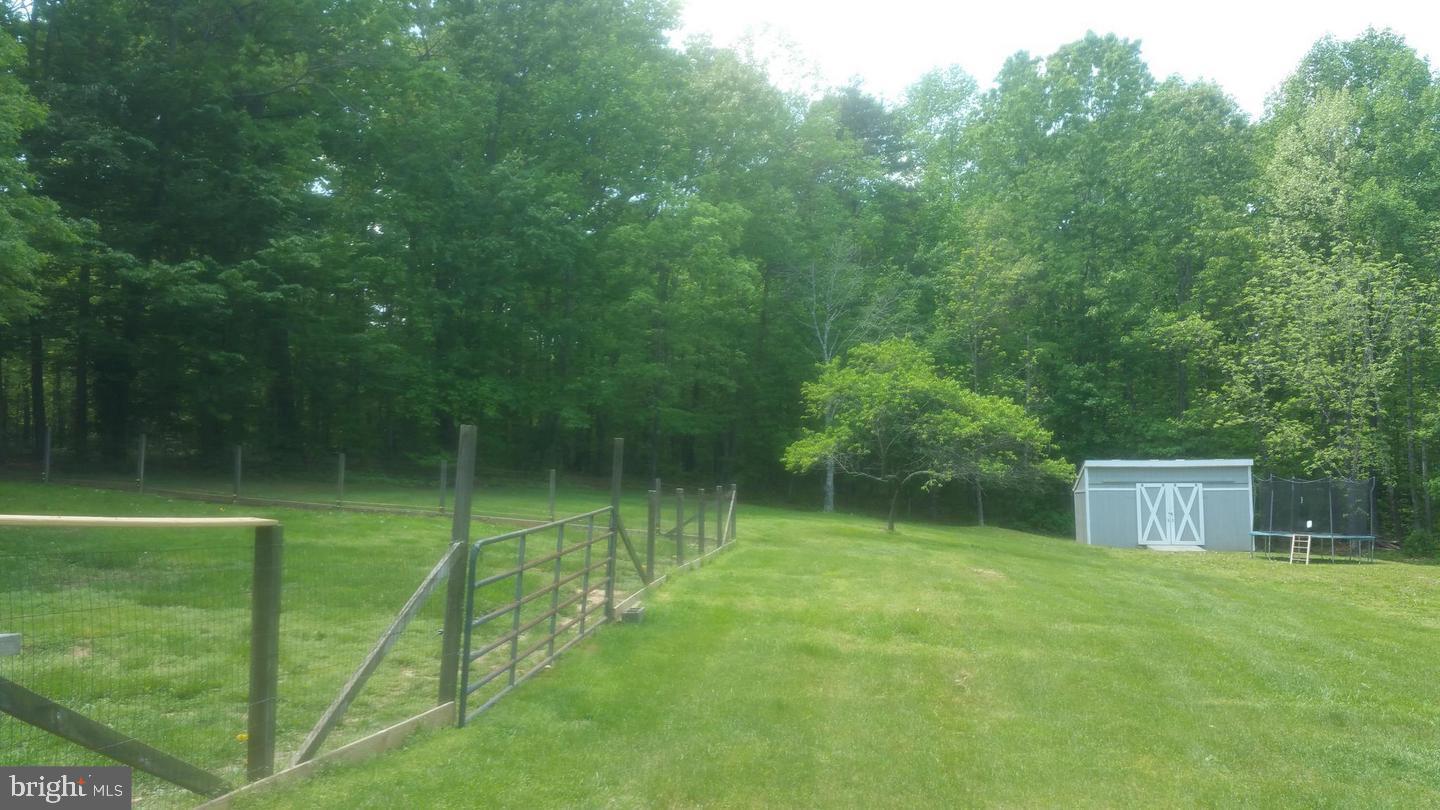 6004 Burr Hill Road Rhoadesville, VA 22542 - Photo 19 of 21 Backyard Shed 2 of 2 Yard Extends Past Fence!