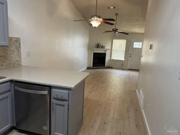 a view of a kitchen with a sink and a microwave