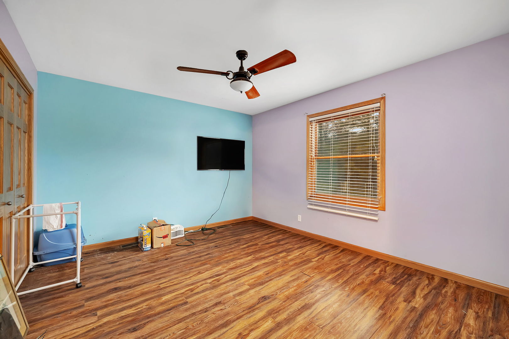 36963 Irish Lane Custer Park, IL 60481 - Photo 22 of 49 a view of an empty room with wooden floor and a window