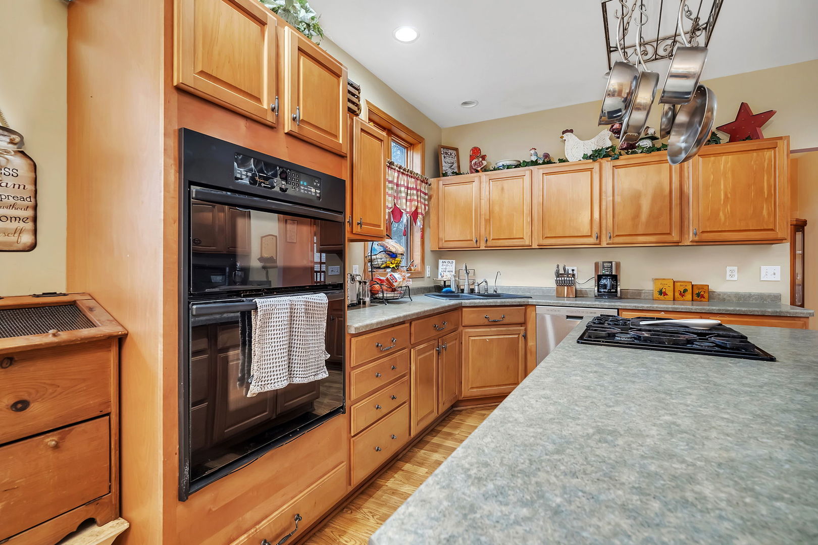 36963 Irish Lane Custer Park, IL 60481 - Photo 8 of 49 a kitchen with stainless steel appliances a stove a sink and a microwave