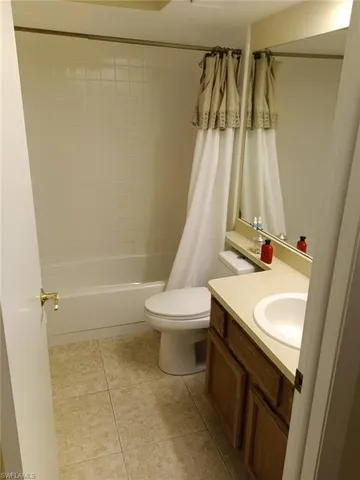 a bathroom with a sink a toilet and a shower