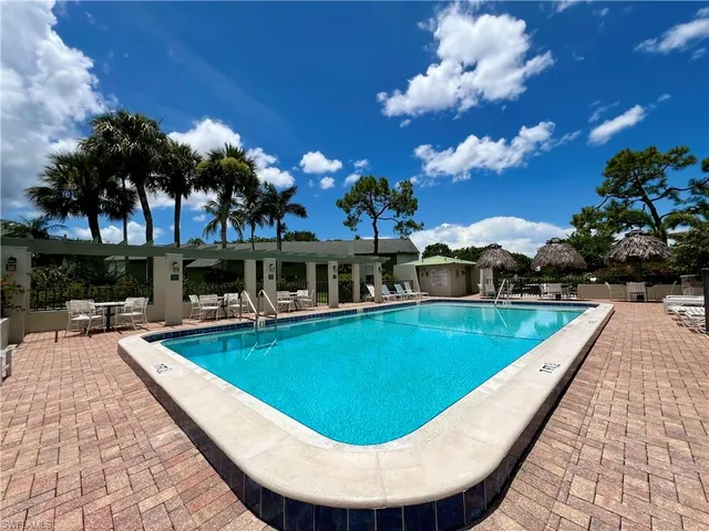a view of a swimming pool with a patio