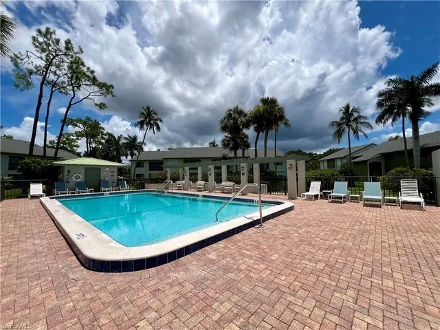a view of a swimming pool with a patio
