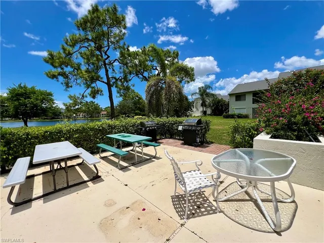 a view of a patio with swimming pool