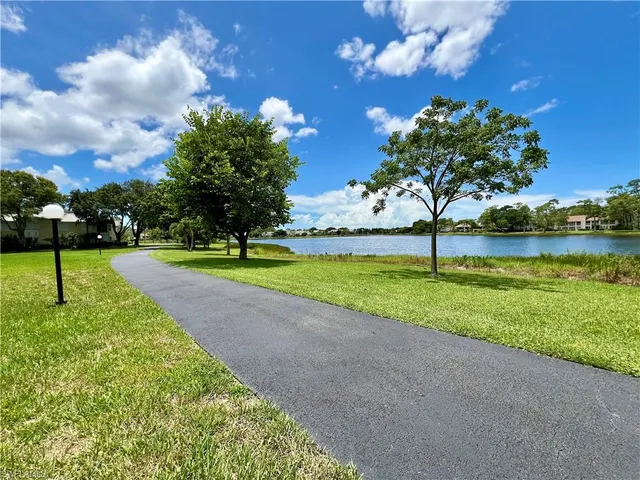 a view of a golf course with a lake