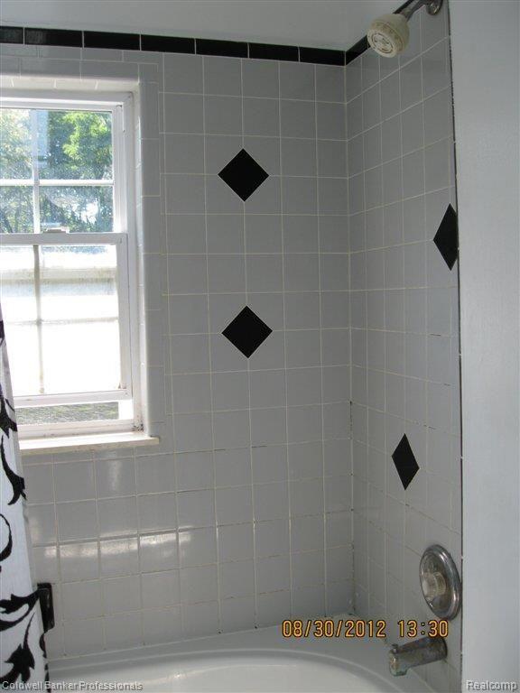 8365 Woodview Road Clarkston, MI 48348 - Photo 22 of 24 MBath Shower Tile Detail .JPG