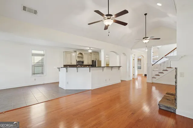 a view of a kitchen with a sink and a window