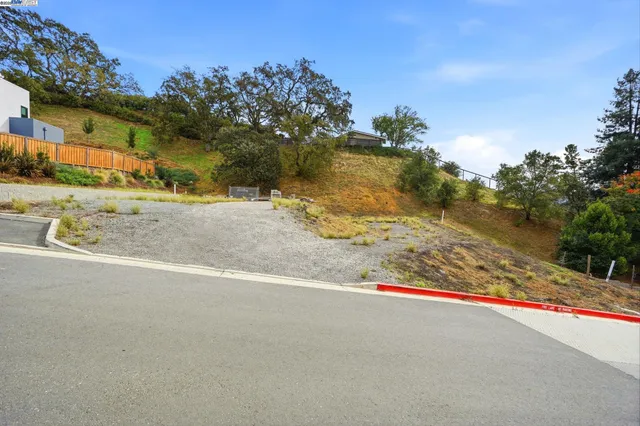 a view of a road with a building in the background