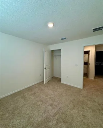 an empty room with closet area