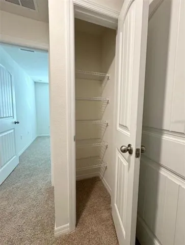 a view of a small space in front of a house