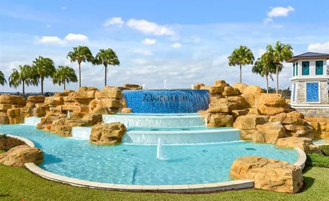 a view of a swimming pool with a sitting space