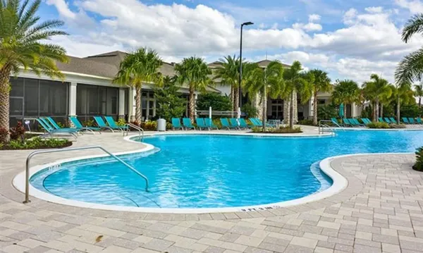 a view of a patio with couches table and chairs and potted plants