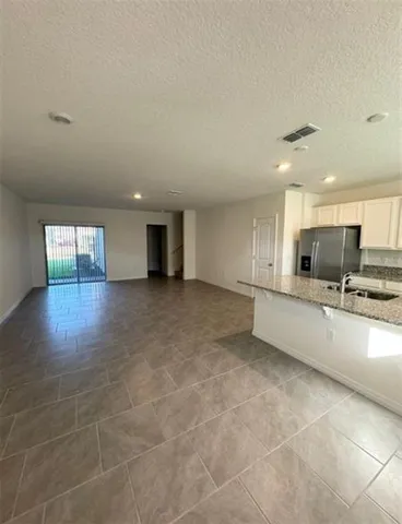 a view of kitchen with furniture and window
