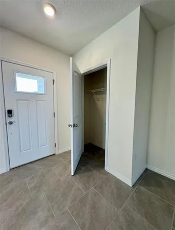 an empty room with closet area