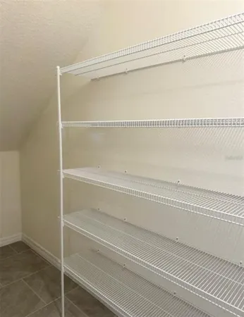 a close view of closet with wooden floor