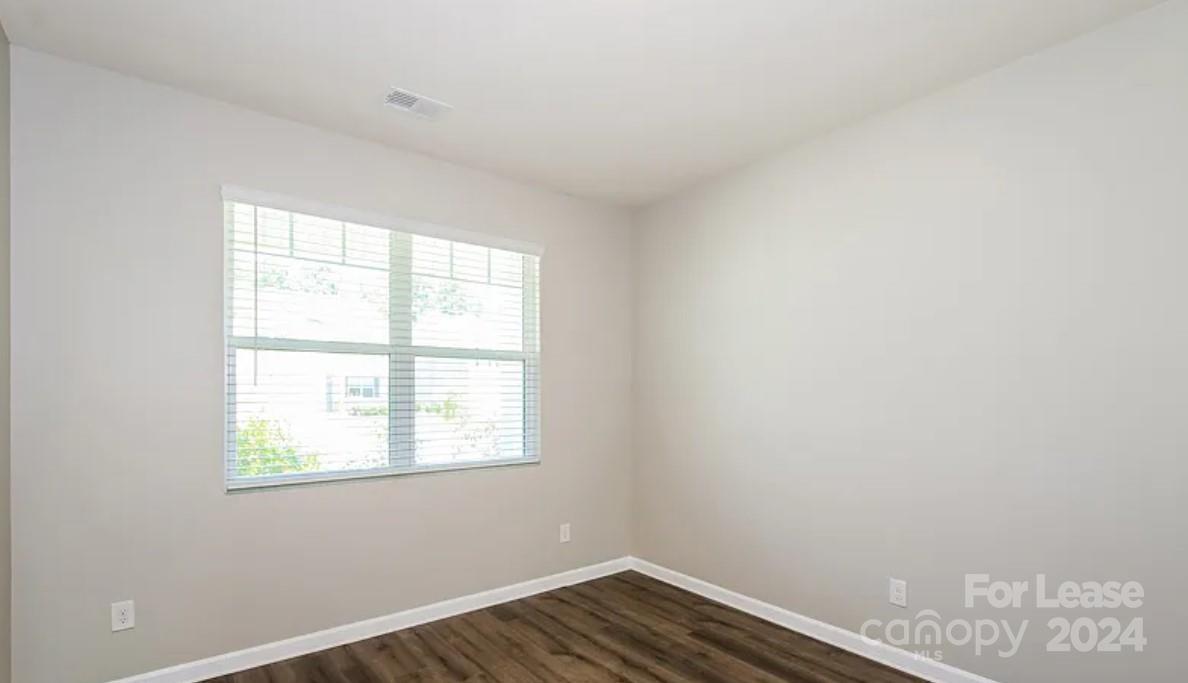 148 Lookout Loop North Augusta, SC 29841 - Photo 7 of 14 an empty room with wooden floor and windows