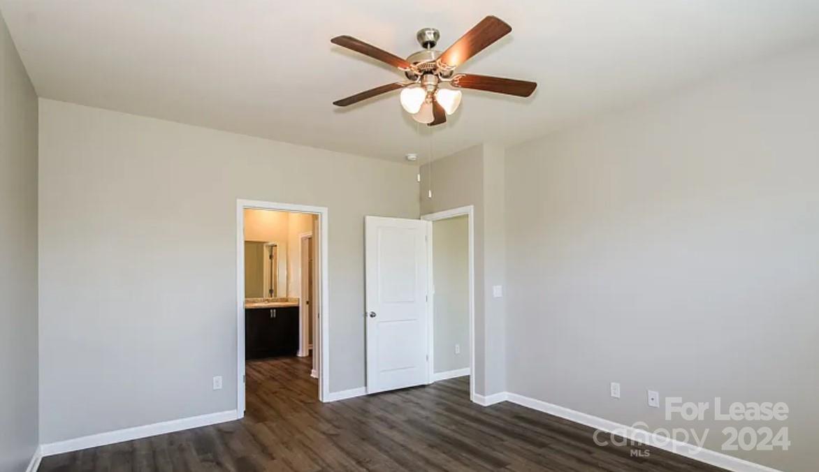 148 Lookout Loop North Augusta, SC 29841 - Photo 8 of 14 an empty room with wooden floor and ceiling fan