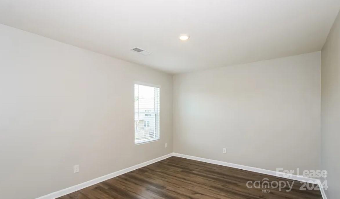148 Lookout Loop North Augusta, SC 29841 - Photo 9 of 14 an empty room with wooden floor and windows