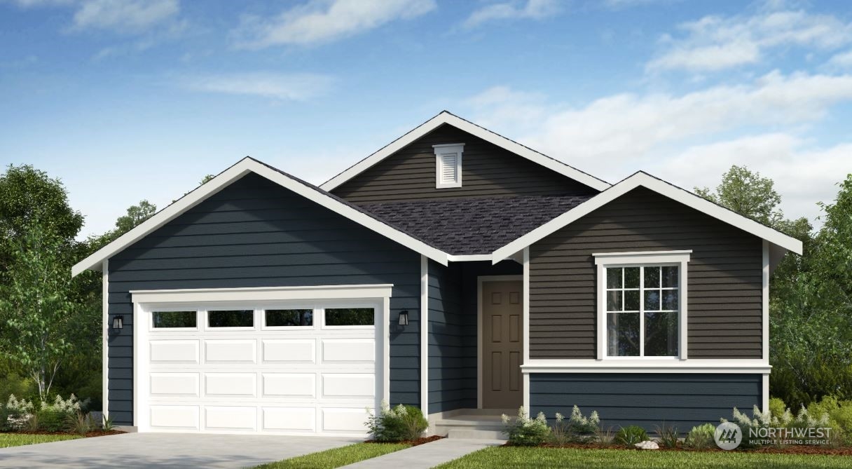 2502 Acer Loop Southeast Lacey, WA 98513 - Photo 1 of 3 a front view of a house with garage