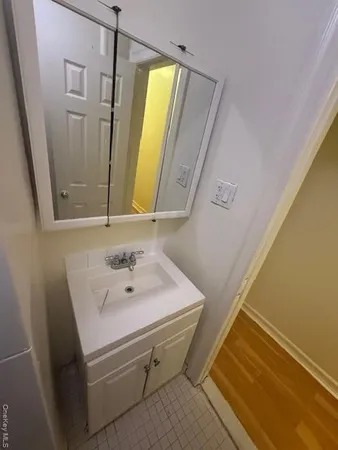 a bathroom with a sink and a mirror