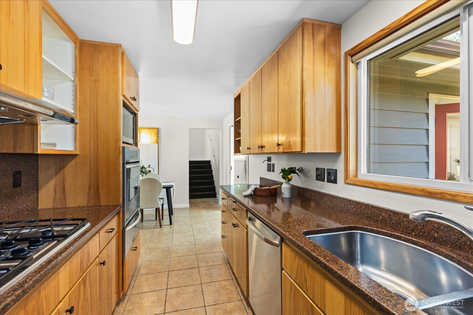 10601 242nd Place Southwest Edmonds, WA 98020 - Photo 12 of 35 a kitchen with stainless steel appliances a sink a stove and a refrigerator