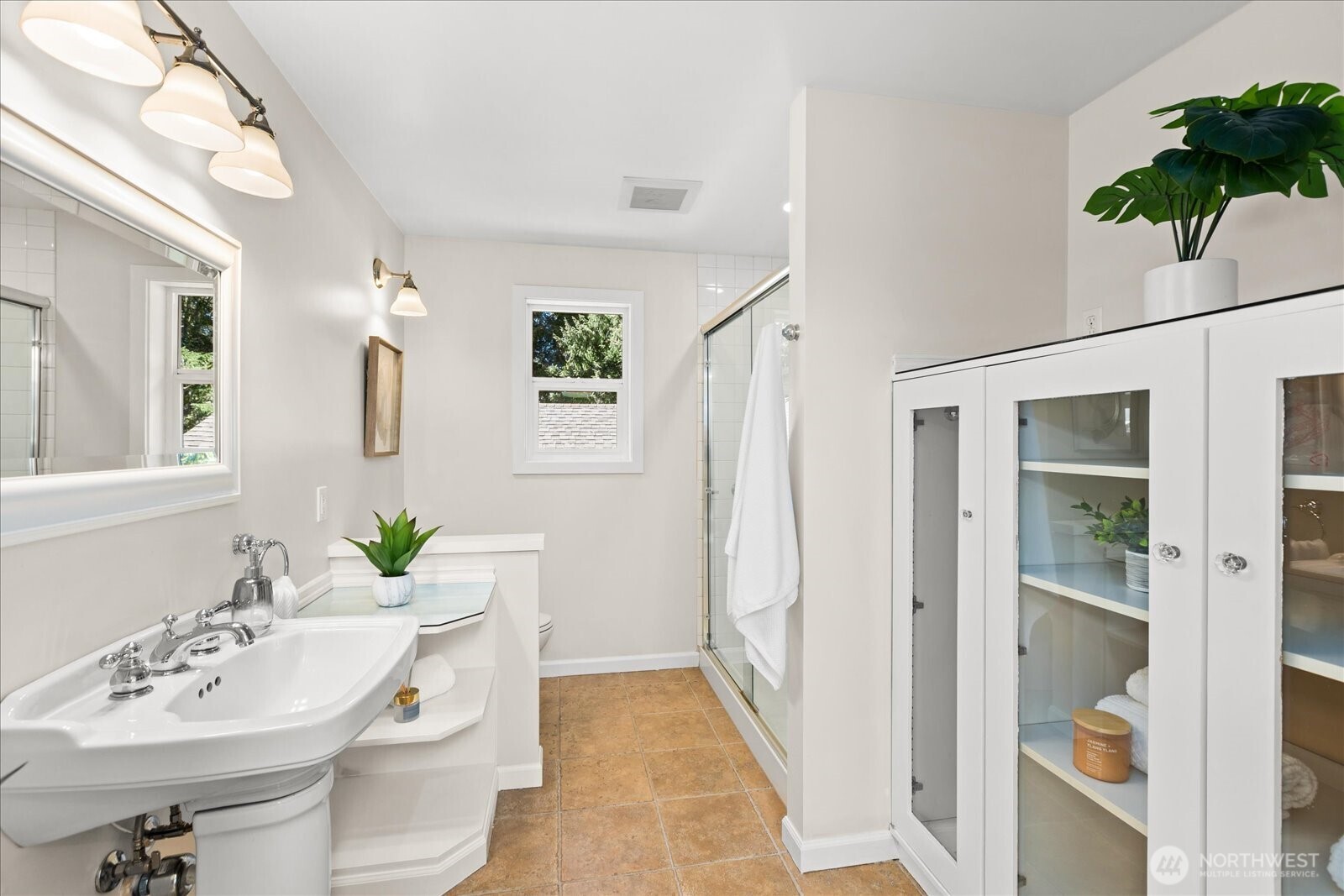 10601 242nd Place Southwest Edmonds, WA 98020 - Photo 15 of 35 a bathroom with a sink a toilet and shower