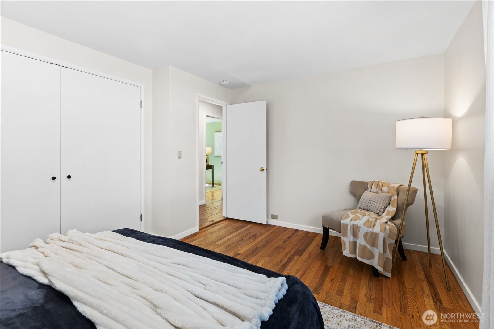 10601 242nd Place Southwest Edmonds, WA 98020 - Photo 18 of 35 a bedroom with a bed and wooden floor