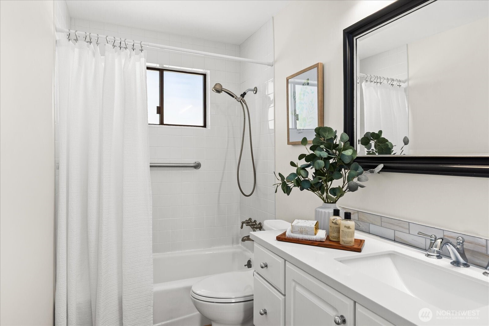 10601 242nd Place Southwest Edmonds, WA 98020 - Photo 22 of 35 a bathroom with a granite countertop sink a toilet and a mirror
